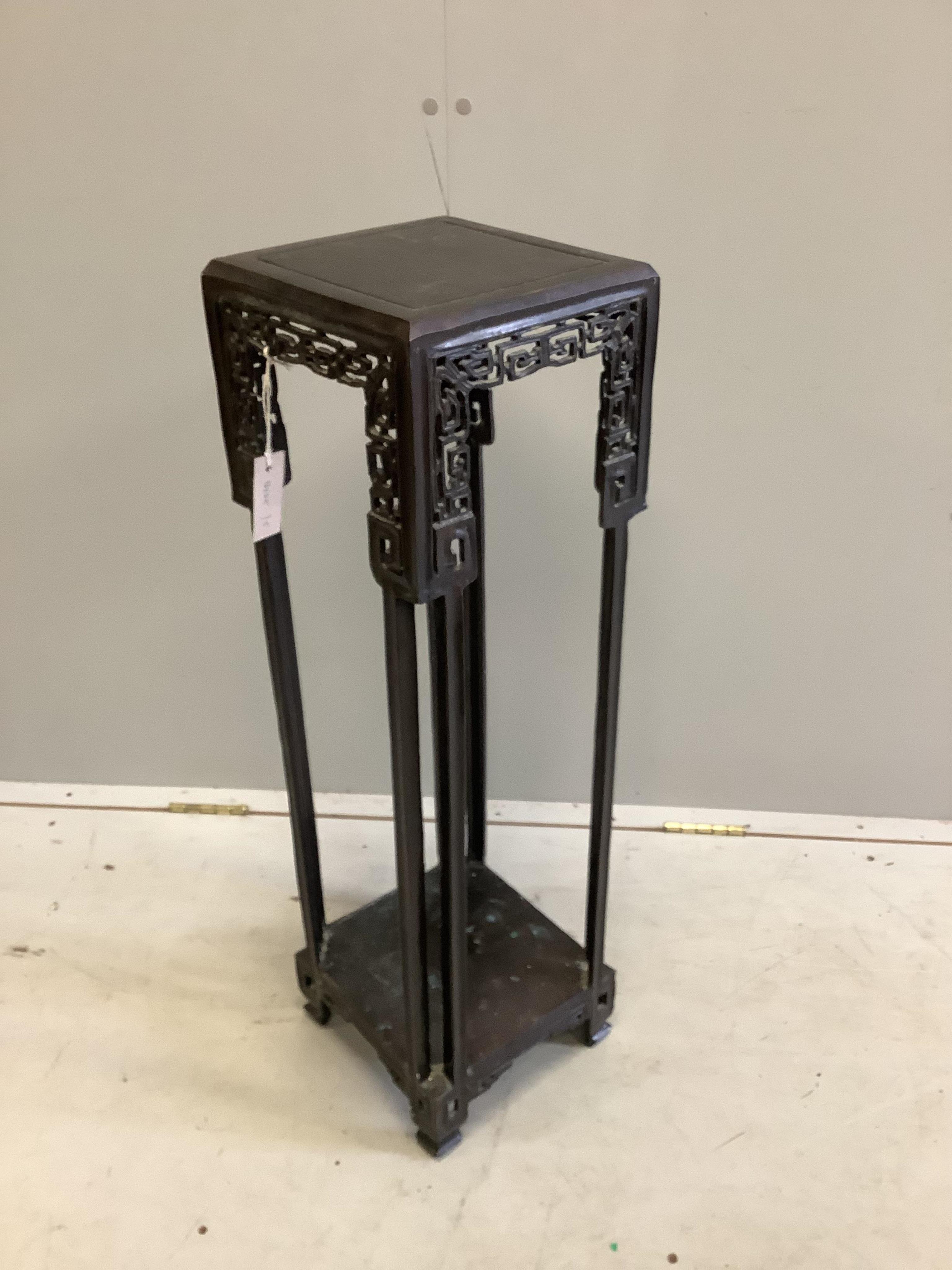 An early 20th century Chinese bronze two tier vase stand, width 24cm, height 82cm. Condition - fair